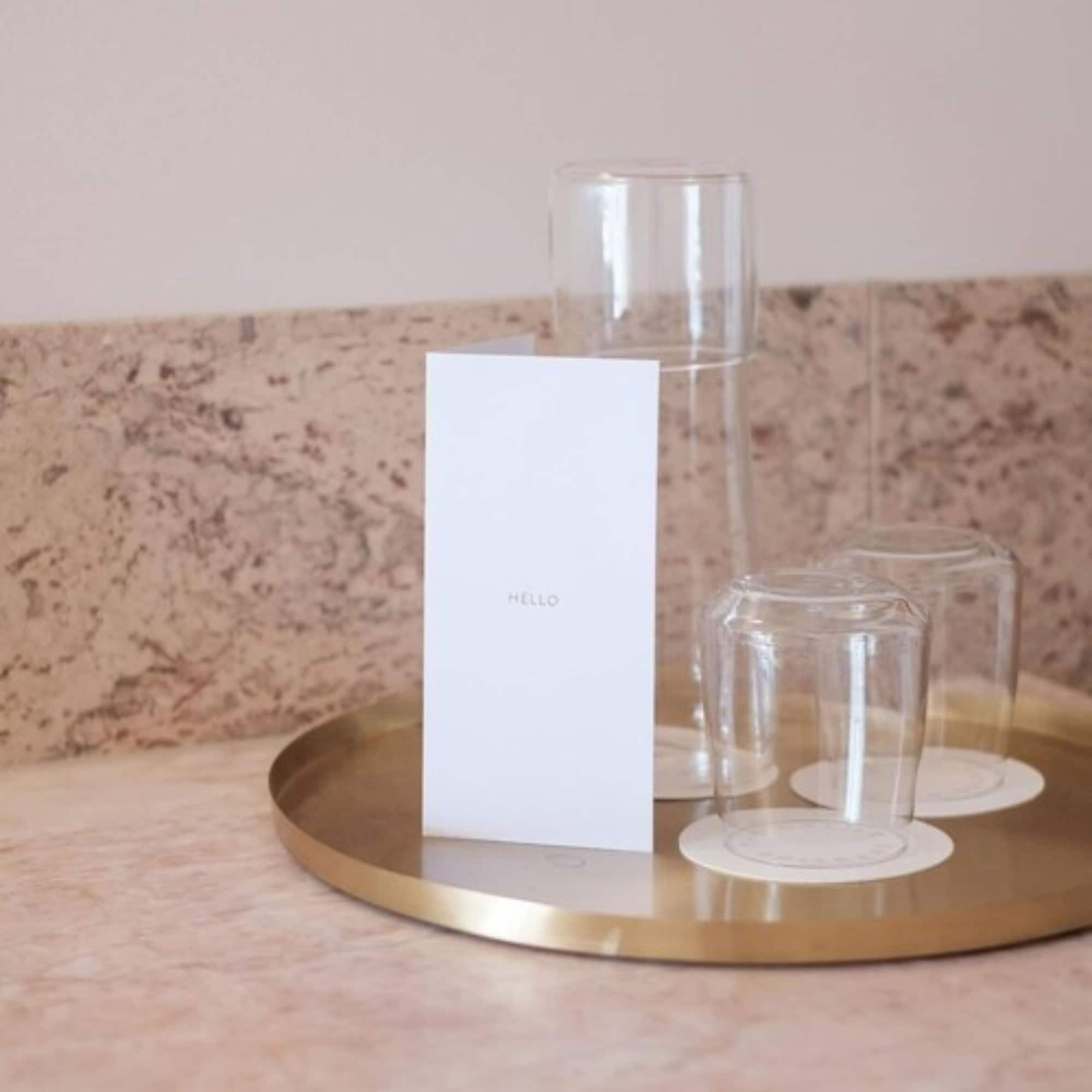 The Calile Hotel Brisbane Exterior foto A tray of water and glasses at a hotel
